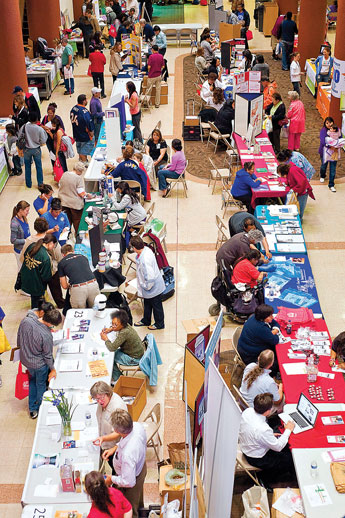 A crowd of health workers, demonstrators and patrons pack Gurley Hall during the RMCH Community Health Fair at UNM-G Wednesday. © 2011 Gallup Independent / Cable Hoover 